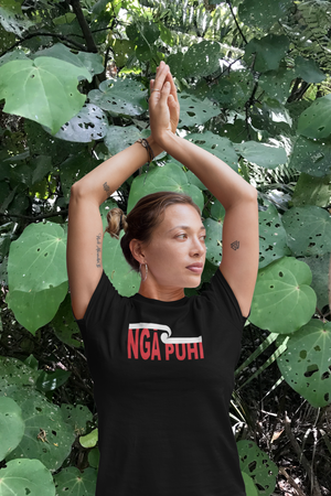 maori woman standing in front of kawakawa plant wearing a custom ngapuhi tee by Mana Ake 